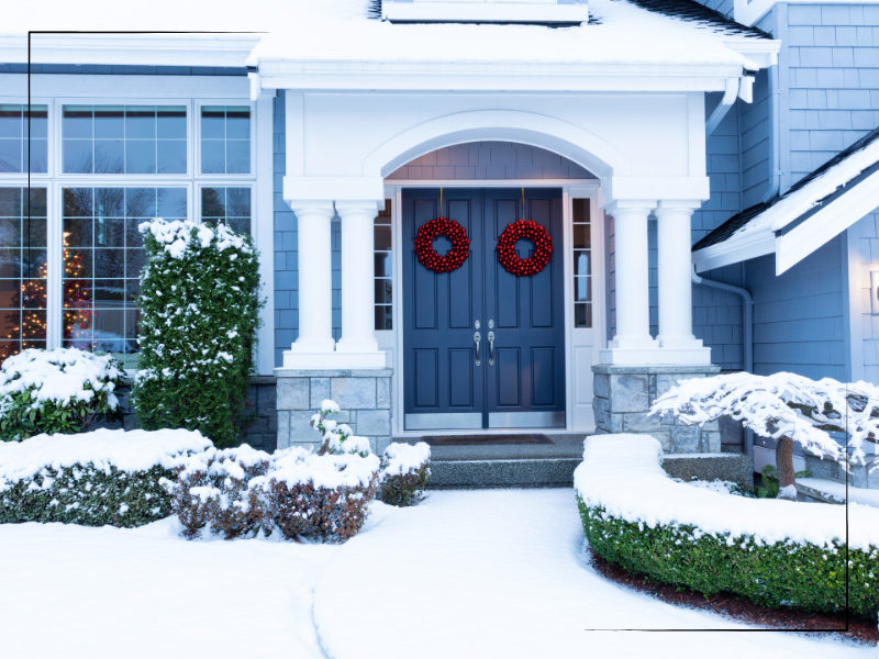 Blue home exterior with Christmas decor